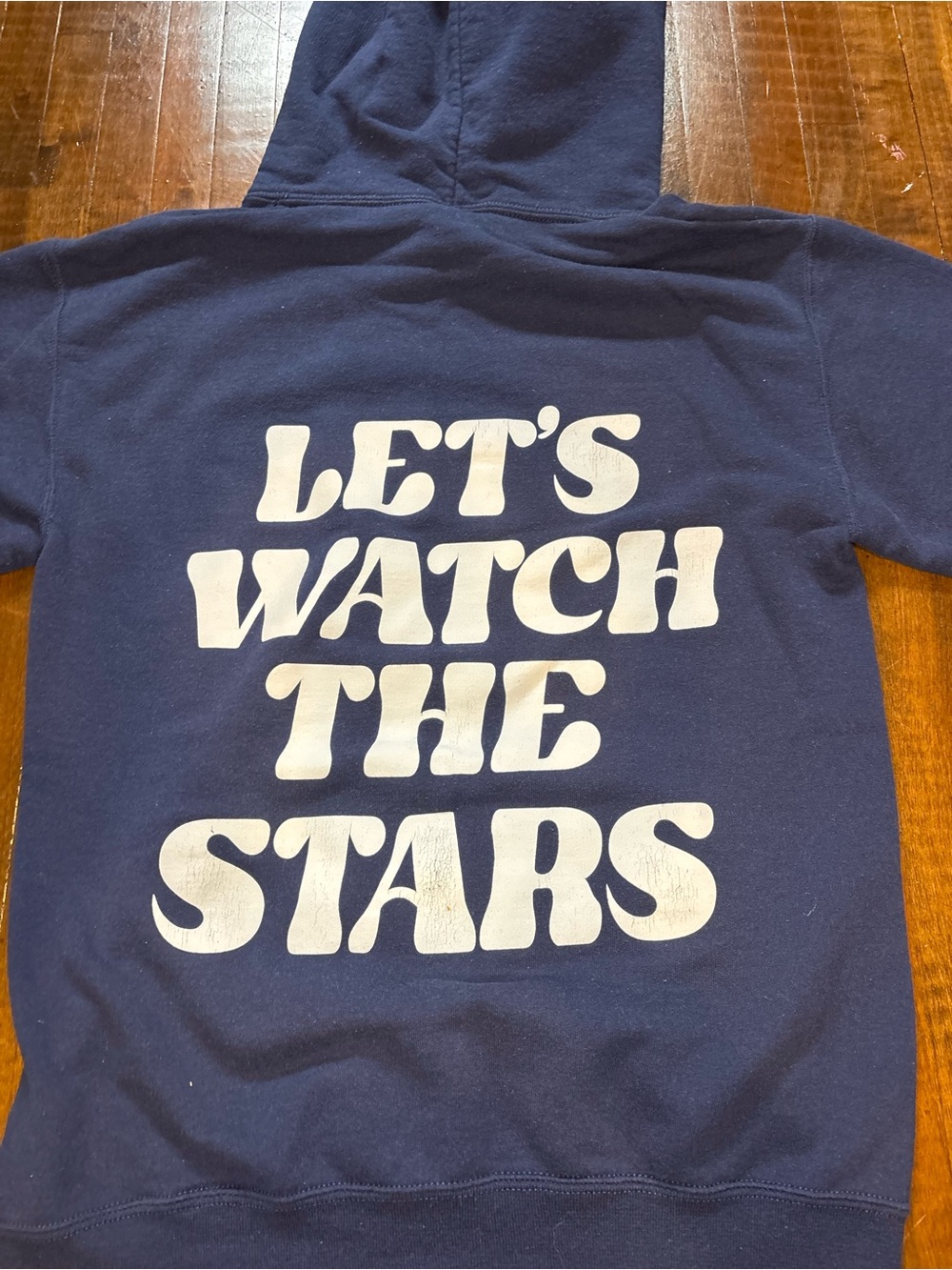 Blue Jade Finds Navy Hoodie with "Let's Watch The Stars" Graphic